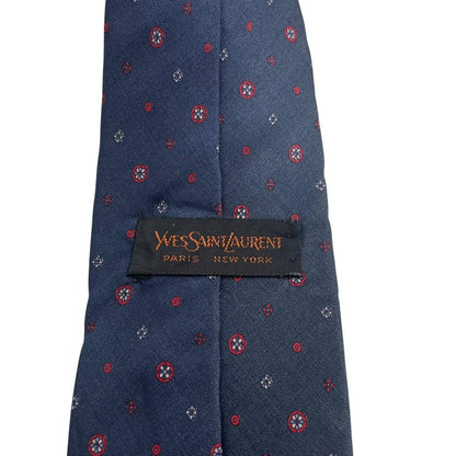 Yves Saint Laurent navy blue silk tie with subtle sheen and classic design.