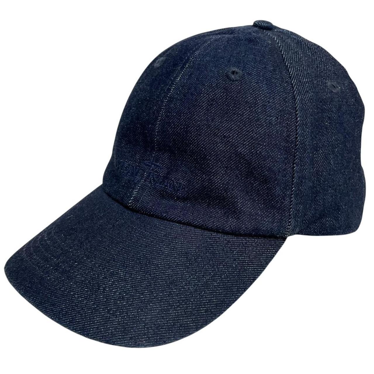 Stone Island blue denim baseball cap with diagonal twill texture and logo patch.