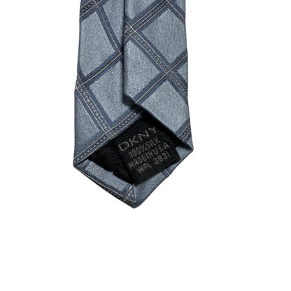 DKNY light blue silk tie with subtle sheen and vintage design.