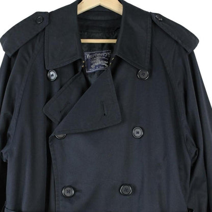 Burberry navy blue belted double breasted trench coat with iconic check lining.
