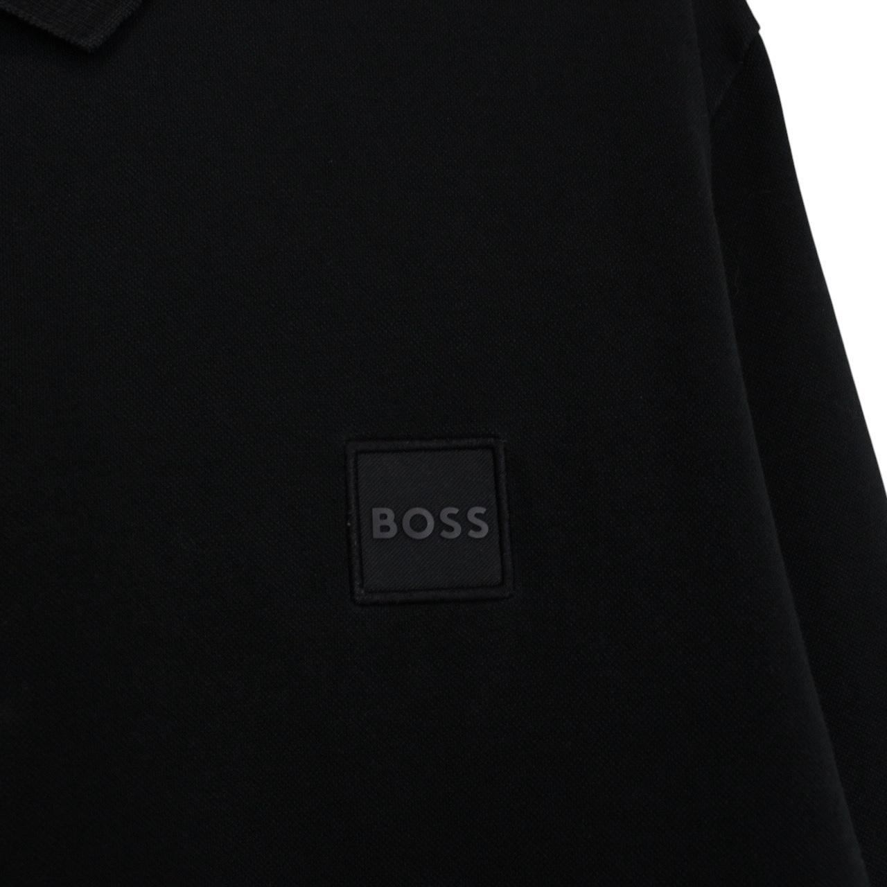 Hugo Boss black long sleeve polo shirt, slim fit, cotton material, subtle wear marks.