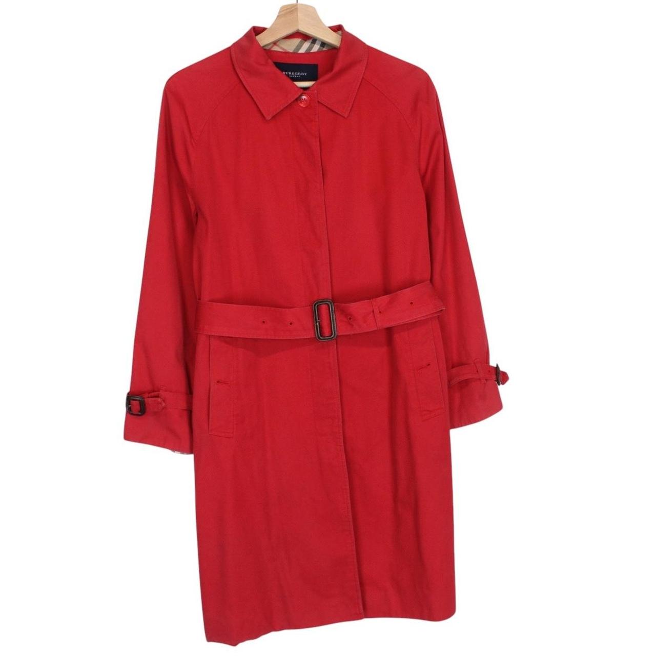 Burberry red trench coat with Nova Check pattern and belted waist detail.