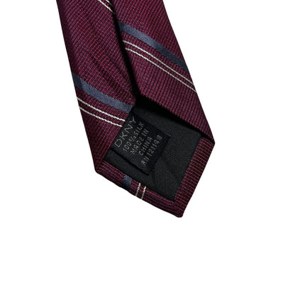 DKNY plum purple silk tie with a smooth finish and vintage design.
