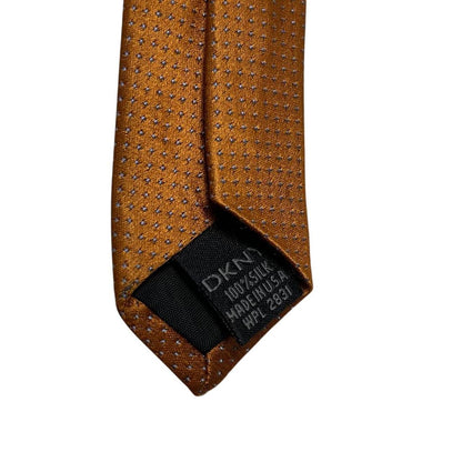 DKNY vintage silk tie in mustard brown with subtle sheen and classic design.