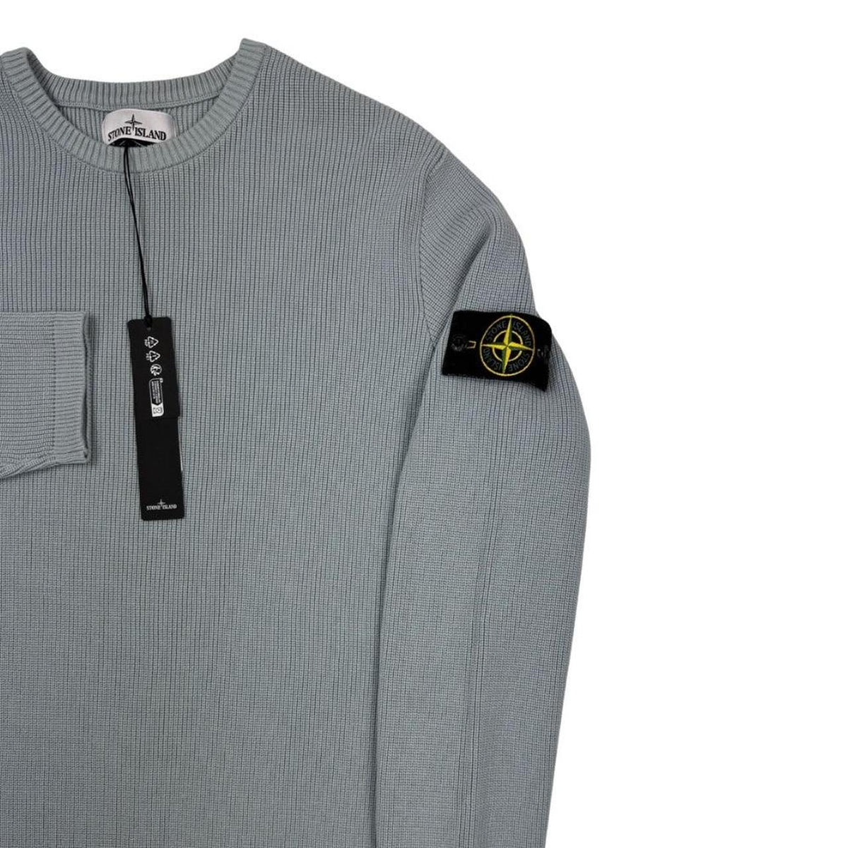 Stone Island grey waffle knit jumper with logo patch and organic cotton material.