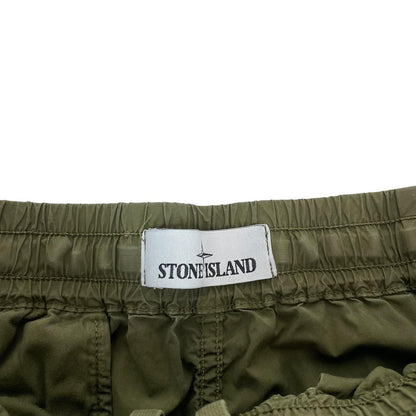 Stone Island khaki green cargo trousers with logo patch and multiple pockets.