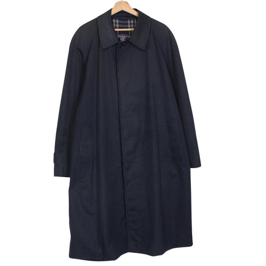 Burberry navy blue trench coat featuring classic Nova Check pattern and single-breasted design.