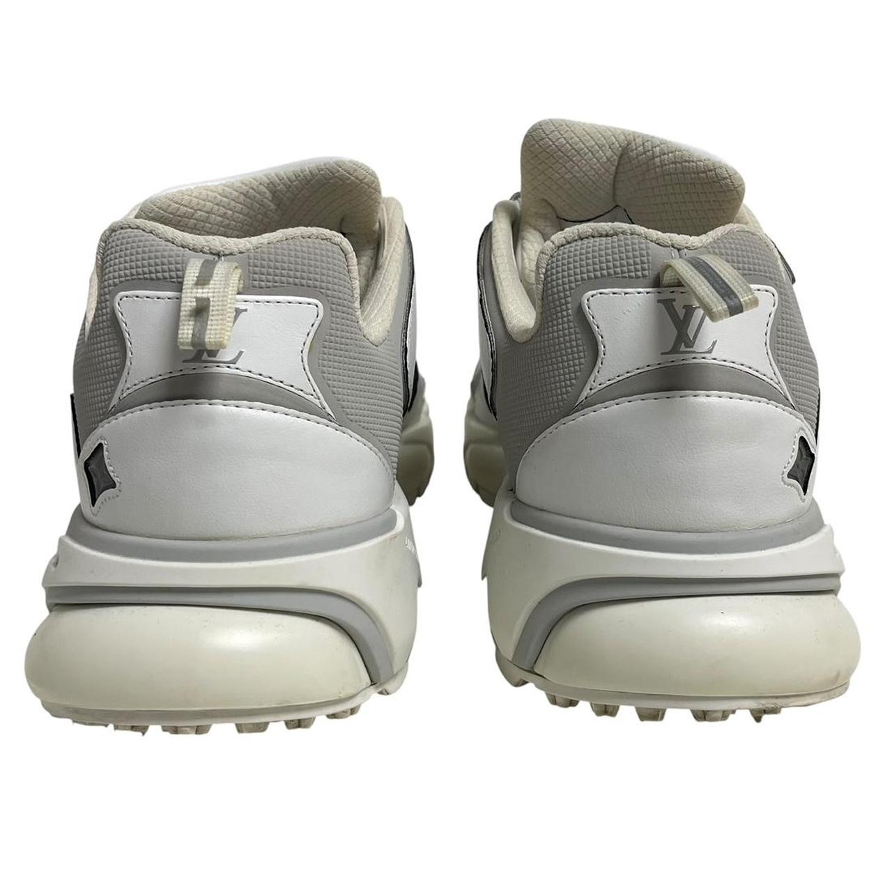 Louis Vuitton white trainers with logo detailing and sleek design, pre-owned condition.