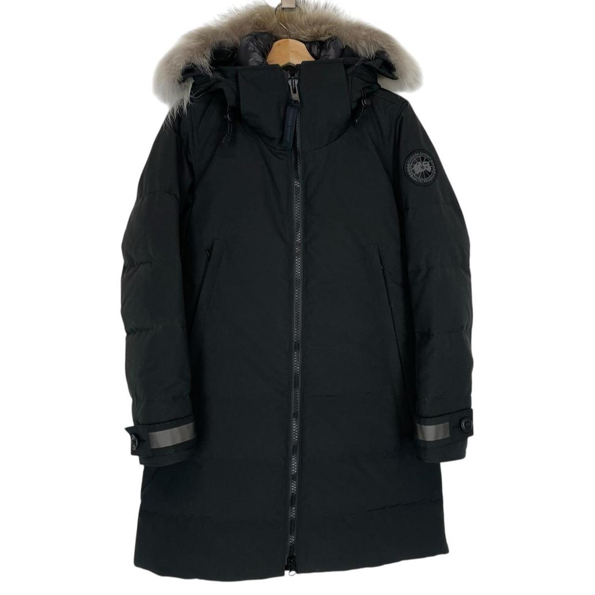 Canada Goose black parka with fur trim, logo patch, and down insulation.