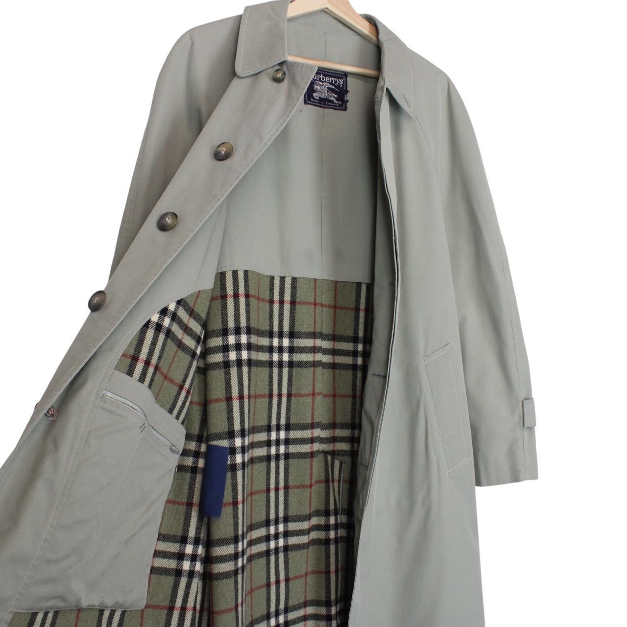 Burberry green trench coat with Nova Check pattern and single-breasted design.