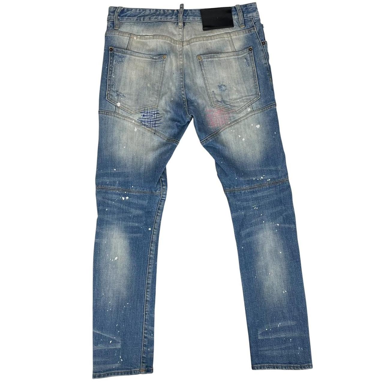 Dsquared2 blue straight jeans with distressed details and logo patch on back pocket.