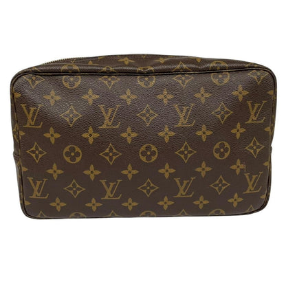 Louis Vuitton brown and tan monogram toiletry pouch with iconic logo and canvas material.