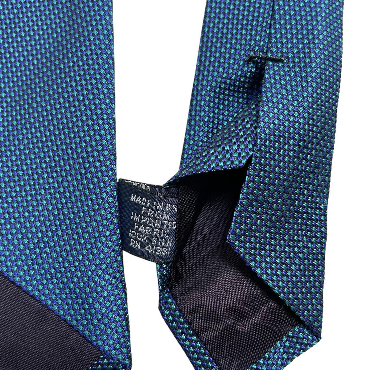 Polo Ralph Lauren blue silk tie with classic logo and smooth texture.