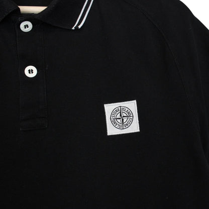 Stone Island black polo shirt with embroidered compass logo and cotton material.