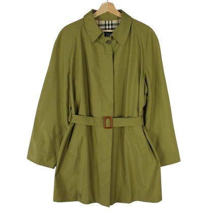 Burberry green trench coat with Nova Check pattern and belted waist detail.