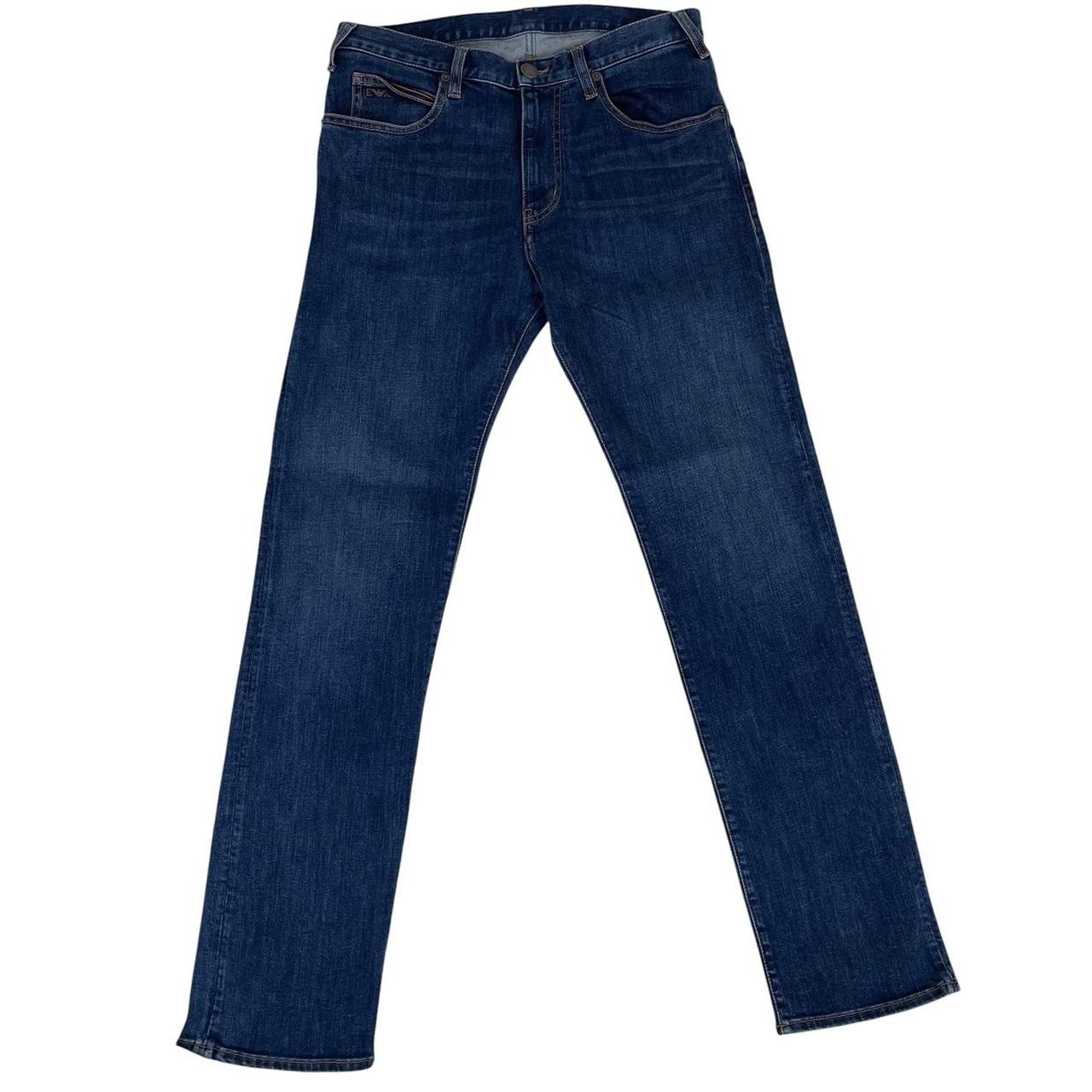 Emporio Armani navy blue slim fit denim jeans with logo patch and classic five-pocket design.