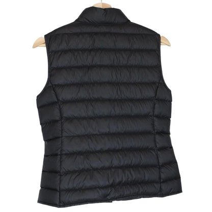 Moncler black quilted shell down gilet with logo patch and zip pockets.