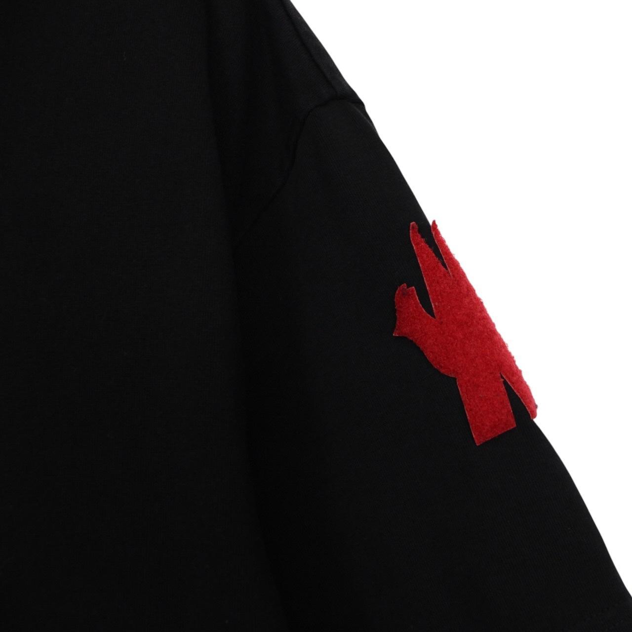 Moncler black and white short sleeve t-shirt with vertical logo design.