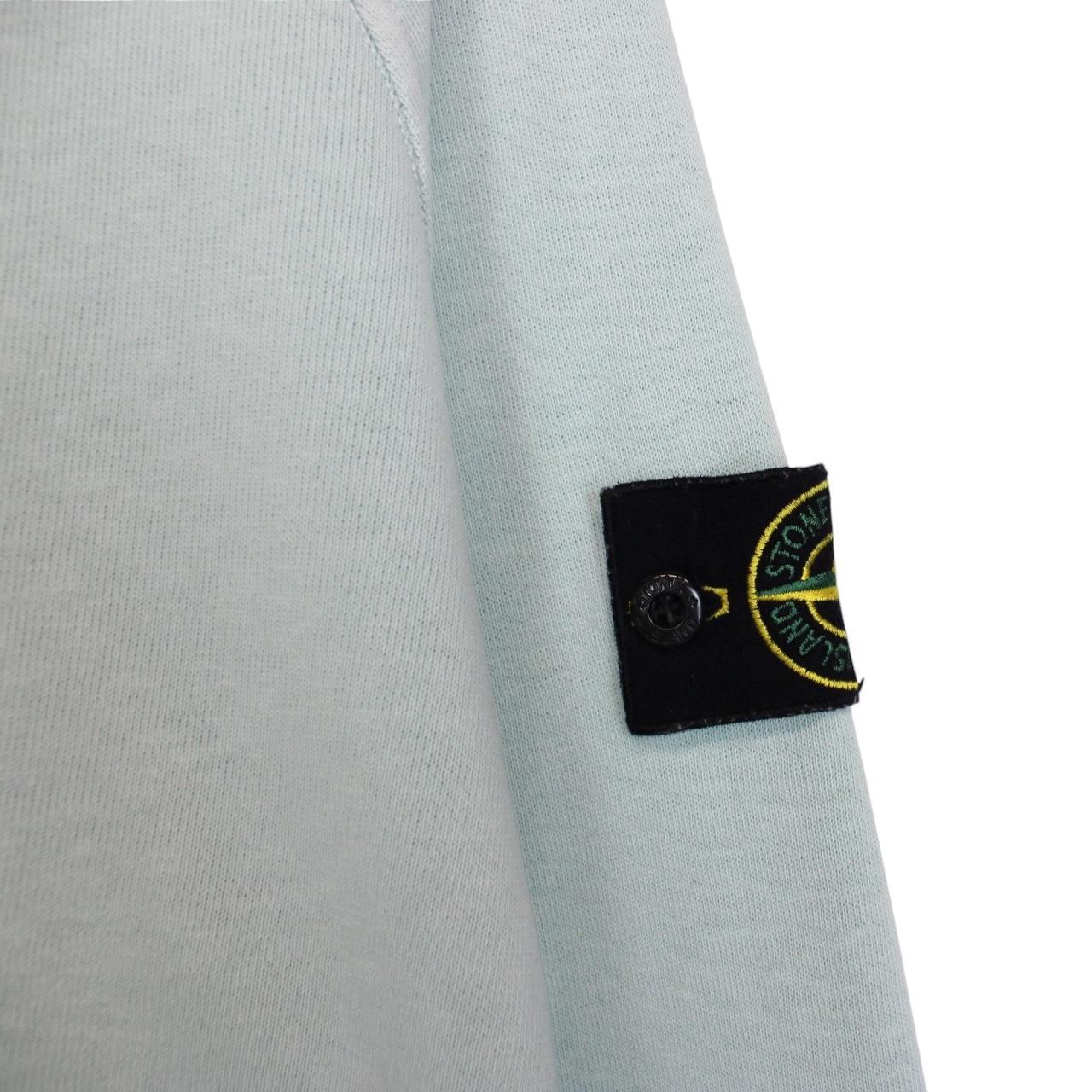 Stone Island mint green cotton sweatshirt with logo patch and ribbed cuffs.